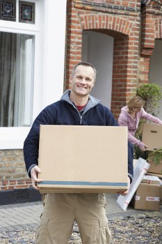 Removal team sorting recyclable materials during a move in Scotland