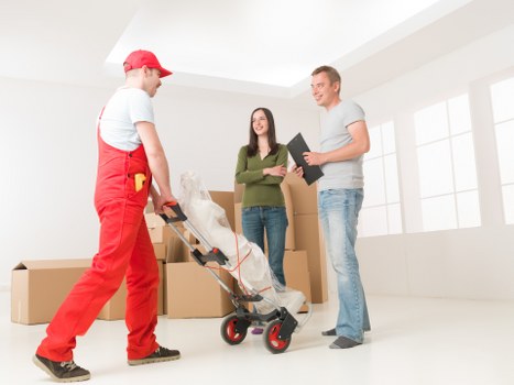 Packing and loading furniture into a removals van