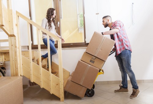 Unpacking support in a flat with boxes arranged by room