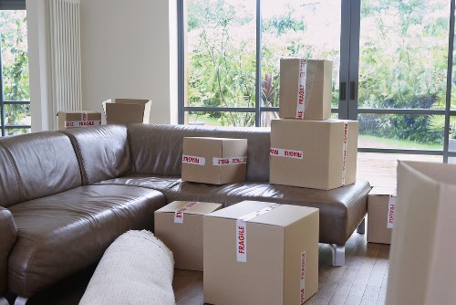 Mover handling boxes and furniture for a local Scottish removal job