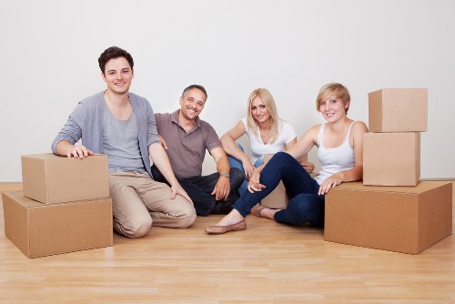 Packed moving boxes and furniture ready for a house move in Scotland